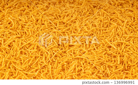 Aloo bhujia indian snack isolated. Crispy potato and chickpea flour strips, alu bhujiya sev Aloo bhujia indian snack isolated. Crispy potato and chickpea flour strips, alu bhujiya sev 136996991