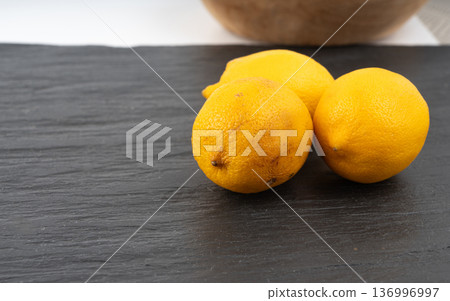 Old dried lemons. Fruits with darkened skins 136996997