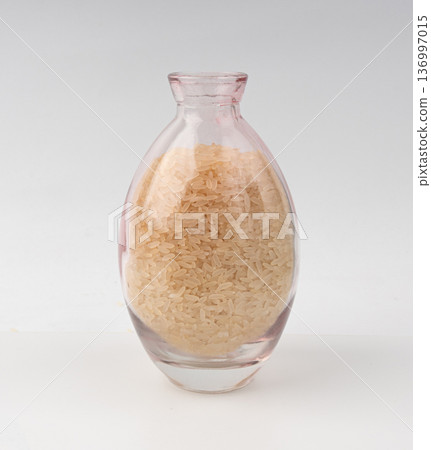 White parboiled rice grains. Dry uncooked ponni rice, small organic basmati White parboiled rice grains. Dry uncooked ponni rice, small organic basmati 136997015