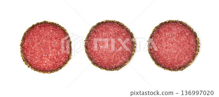 Pepper salami cuts isolated, thin sausage slices. Sliced dry chorizo, sausages round pieces 136997020
