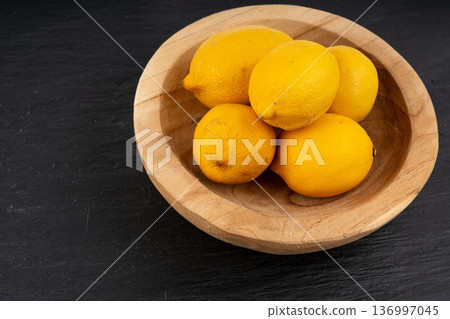 Old dried lemons. Fruits with darkened skins 136997045