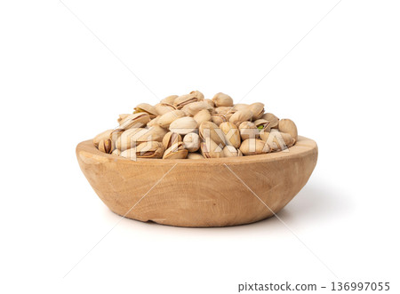 Fried salt pistachio nuts isolated. Baked pistachios pile, roasted green pistache fruit in shell on white Fried salt pistachio nuts isolated. Baked pistachios pile, roasted green pistache fruit in shell on white 136997055
