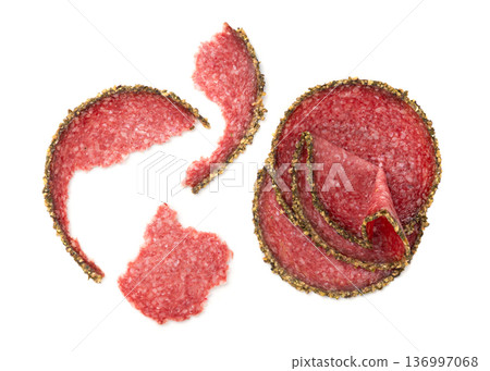 Pepper salami cuts isolated, thin sausage slices. Sliced dry chorizo, sausages round pieces Pepper salami cuts isolated, thin sausage slices. Sliced dry chorizo, sausages round pieces 136997068