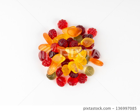 Fruit gummy candy pile isolated, vegan chewing marmalade pills, jelly gumdrops heap Fruit gummy candy pile isolated, vegan chewing marmalade pills, jelly gumdrops heap 136997085