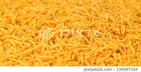 Aloo bhujia indian snack isolated. Crispy potato and chickpea flour strips, alu bhujiya sev Aloo bhujia indian snack isolated. Crispy potato and chickpea flour strips, alu bhujiya sev 136997184