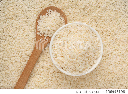 Grated coconut powder. Dry coco flakes pile, shredded desiccated coconut, tropical fruit chips Grated coconut powder. Dry coco flakes pile, shredded desiccated coconut, tropical fruit chips 136997198