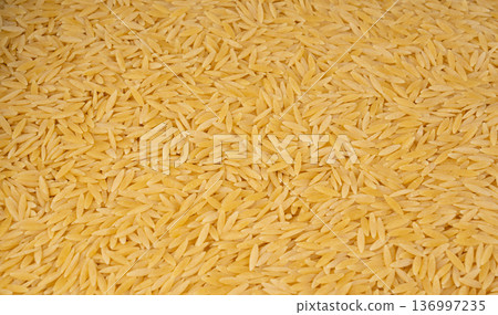 Raw orzo pasta, risoni or kritharaki pile Raw orzo pasta, risoni or kritharaki pile 136997235