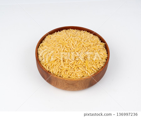 Raw orzo pasta, risoni or kritharaki pile 136997236