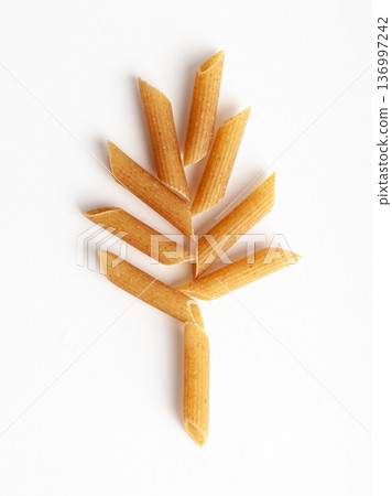 Raw Brown Pasta, Wholegrain Penne, Dry Whole Grain Noodle, Raw Spelt Macaroni, Healthy Italy Food Raw Brown Pasta, Wholegrain Penne, Dry Whole Grain Noodle, Raw Spelt Macaroni, Healthy Italy Food 136997242