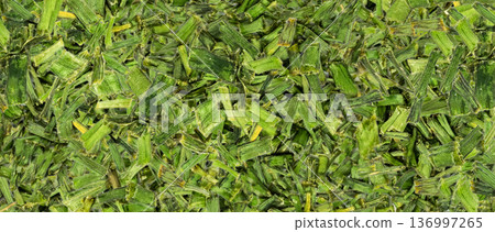 Dry chive pile pattern. Dried green onion flakes textured background Dry chive pile pattern. Dried green onion flakes textured background 136997265
