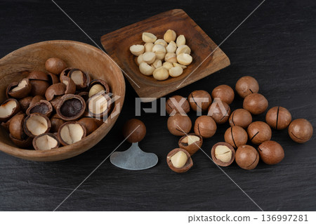 Macadamia nuts. Natural raw peeled macadamia seeds and shells Macadamia nuts. Natural raw peeled macadamia seeds and shells 136997281