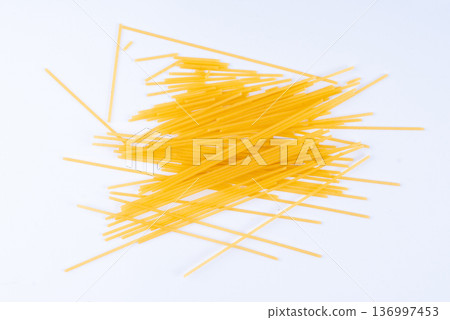 Raw spaghetti isolated, dry spagetti, long wheat noodles, uncooked italian macaroni bundle 136997453