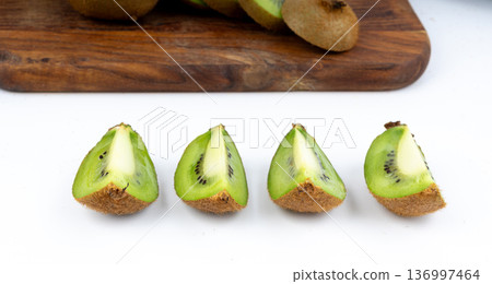 Kiwi fruit isolated. Green kiwifruit slice, kivi cut Kiwi fruit isolated. Green kiwifruit slice, kivi cut 136997464