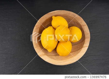 Old dried lemons. Fruits with darkened skins 136997476