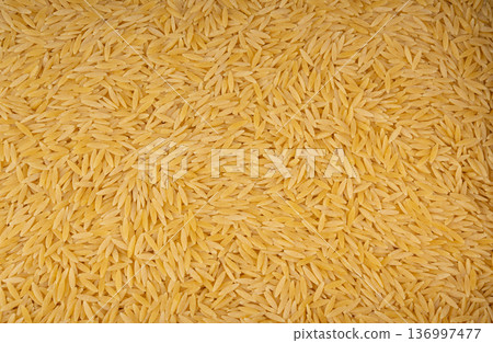 Raw orzo pasta, risoni or kritharaki pile 136997477
