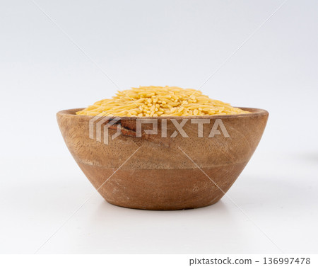 Raw orzo pasta, risoni or kritharaki pile 136997478