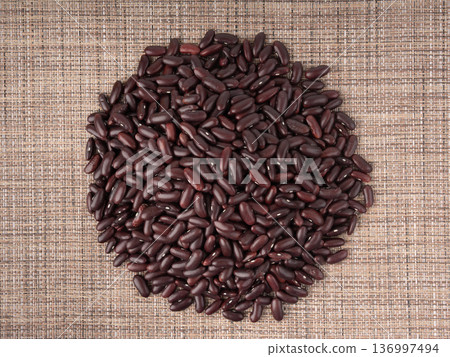 Red dry kidney beans. Uncooked bean pile, raw legume or red beans, rajma Red dry kidney beans. Uncooked bean pile, raw legume or red beans, rajma 136997494
