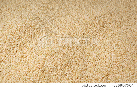 Sesame seeds pile textured background 136997504