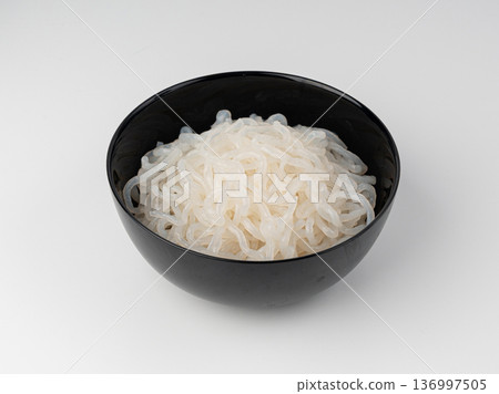 Shirataki or konnyaku pasta in black bowl isolated. Konjak jelly noodles, Japanese zero calorie sirataki 136997505