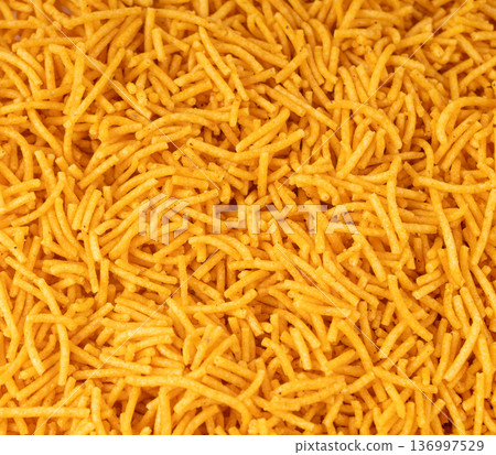 Aloo bhujia indian snack isolated. Crispy potato and chickpea flour strips, alu bhujiya sev Aloo bhujia indian snack isolated. Crispy potato and chickpea flour strips, alu bhujiya sev 136997529
