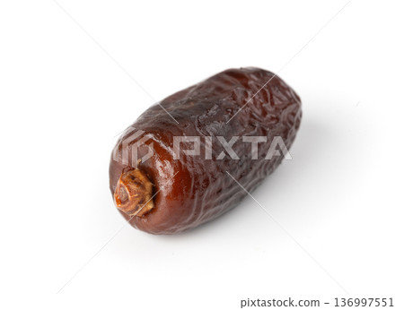 Macro close-up of a dry date isolated Macro close-up of a dry date isolated 136997551