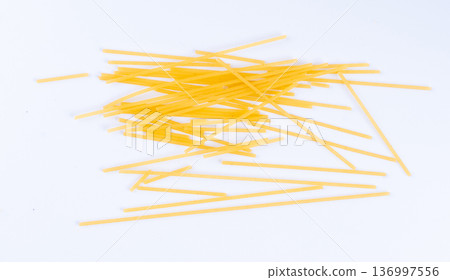Raw spaghetti isolated, dry spagetti, long wheat noodles, uncooked italian macaroni bundle Raw spaghetti isolated, dry spagetti, long wheat noodles, uncooked italian macaroni bundle 136997556