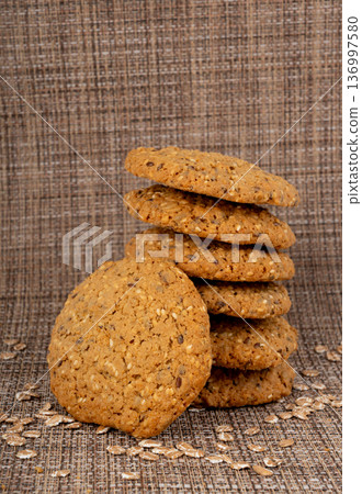 Whole and broken oatmeal cookies, cereal biscuits, fitness bakery 136997580