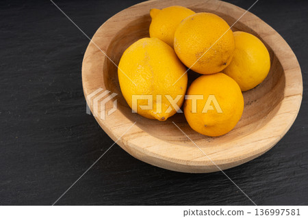 Old dried lemons. Fruits with darkened skins Old dried lemons. Fruits with darkened skins 136997581