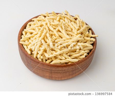 Raw Trofie Pasta, Dry Italian Macaroni, Traditional Genoa Food, Raw Noodle, Modern Ligurian Cuisine Raw Trofie Pasta, Dry Italian Macaroni, Traditional Genoa Food, Raw Noodle, Modern Ligurian Cuisine 136997584