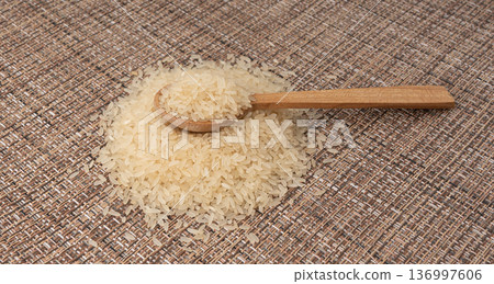 White parboiled rice grains. Dry uncooked ponni rice, small organic basmati White parboiled rice grains. Dry uncooked ponni rice, small organic basmati 136997606