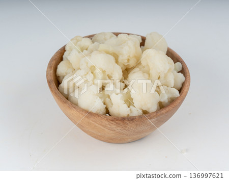 Steamed cauliflower pieces close up Steamed cauliflower pieces close up 136997621