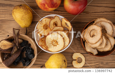 Dry fruit mix in bowl. Dried fruit chips Dry fruit mix in bowl. Dried fruit chips 136997742