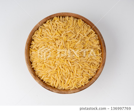 Raw orzo pasta, risoni or kritharaki pile Raw orzo pasta, risoni or kritharaki pile 136997769