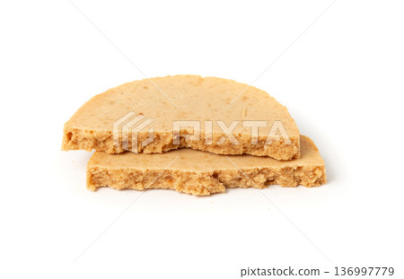 Protein cookie isolated, broken round energy snack with peanuts, chicory fibre Protein cookie isolated, broken round energy snack with peanuts, chicory fibre 136997779