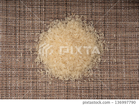 White parboiled rice grains. Dry uncooked ponni rice, small organic basmati 136997790
