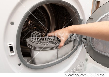 Cleaning dryer lint filter. Laundry dryer 136997849