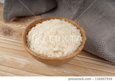 Raw flattened rice. Dry rice flakes or poha, Indian breakfast food 136997936