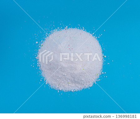 Detergent powder pile. Laundry washing soap granules, small white texture of oxygen bleach 136998181