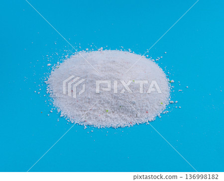 Detergent powder pile. Laundry washing soap granules, small white texture of oxygen bleach 136998182