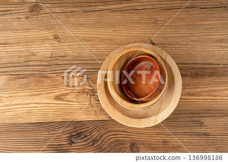 Empty wood bowl on table, plate stack on wooden table, light rustic dish mockup, eco bio Empty wood bowl on table, plate stack on wooden table, light rustic dish mockup, eco bio 136998186