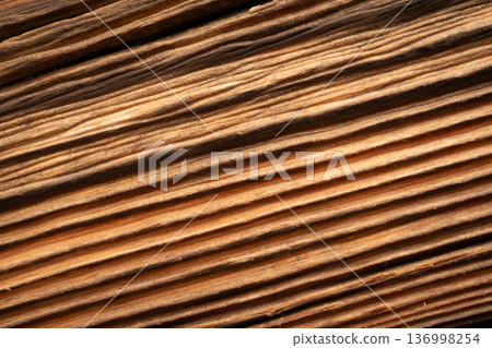 Old wood textured background. Dark driftwood surface, burnt wood brushing, macro brown floor Old wood textured background. Dark driftwood surface, burnt wood brushing, macro brown floor 136998254