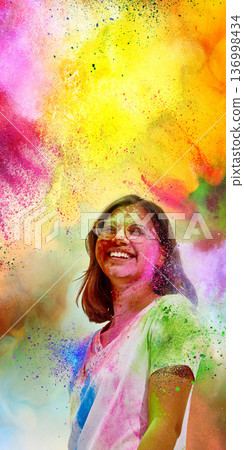 Happy woman in colorful Holi powder cloud with bright background. Happy woman in colorful Holi powder cloud with bright background. 136998434