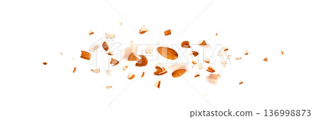 Crushed almonds falling isolated, flying nut pieces, levitate scattered almond seeds Crushed almonds falling isolated, flying nut pieces, levitate scattered almond seeds 136998873
