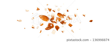 Crushed almonds falling isolated, flying nut pieces, levitate scattered almond seeds 136998874