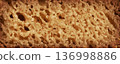 Bread slice macro texture, baked dough pattern. Brown bread loaf cut close up, wheat toast slice 136998886