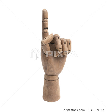 a wooden hand making the pointing gesture with the index finger a wooden hand making the pointing gesture with the index finger 136999144