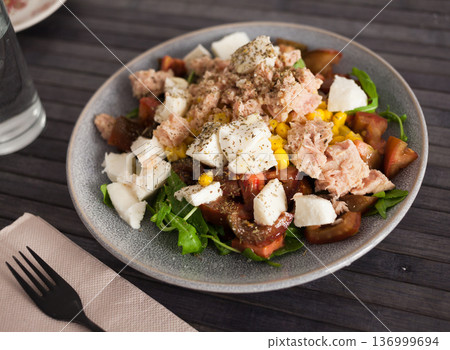 Closeup of salad with fish and vegetables for lunch 136999694
