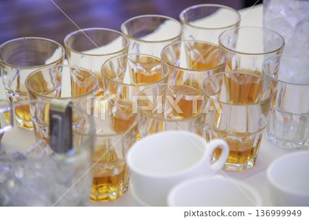 Glasses with drinks at corporate event Glasses with drinks at corporate event 136999949