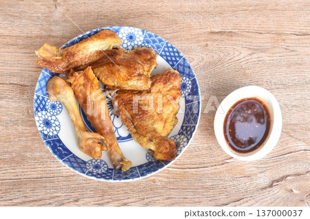 grilled chop chicken meat wing and leg on plate dipping with sweet and spicy sauce grilled chop chicken meat wing and leg on plate dipping with sweet and spicy sauce 137000037