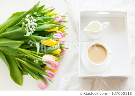 Spring morning breakfast, coffee, milk jug and cake with decor of pink hyacinth. 137000118